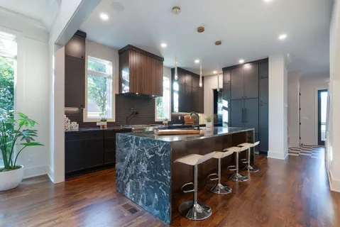a view of staircase with railing and a rug