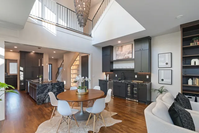 a kitchen with a sink a refrigerator and cabinets