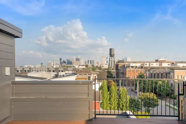 a kitchen with stainless steel appliances granite countertop a stove a sink dishwasher and a refrigerator