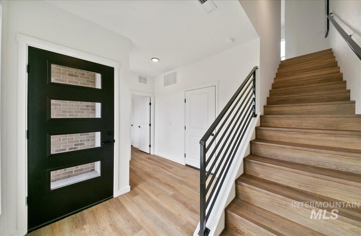 2032 South Mackinnon Lane Boise, ID 83706 - Photo 44 of 48 Entryway featuring stairs, light wood-style flooring, and recessed lighting