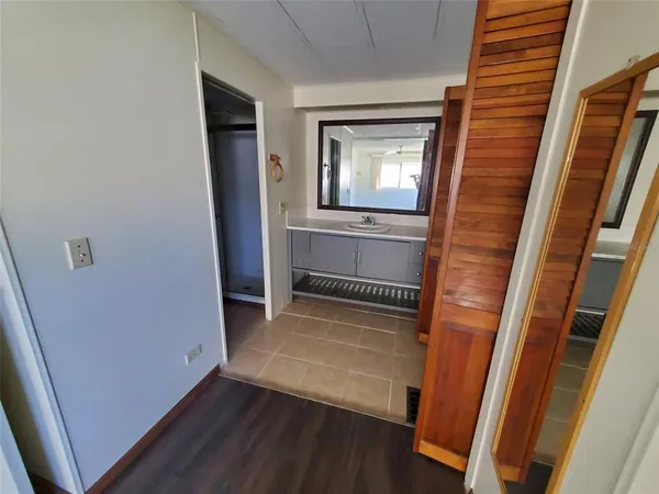 a view of front door with wooden floor