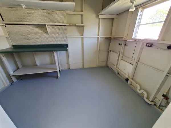 a utility room with multiple dryer and washer