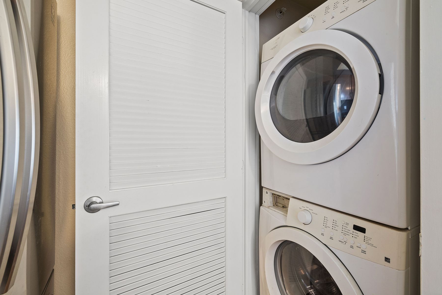 3016 Guadalupe Street, Unit 303 Austin, TX 78705 - Photo 14 of 15 a utility room with dryer and washer