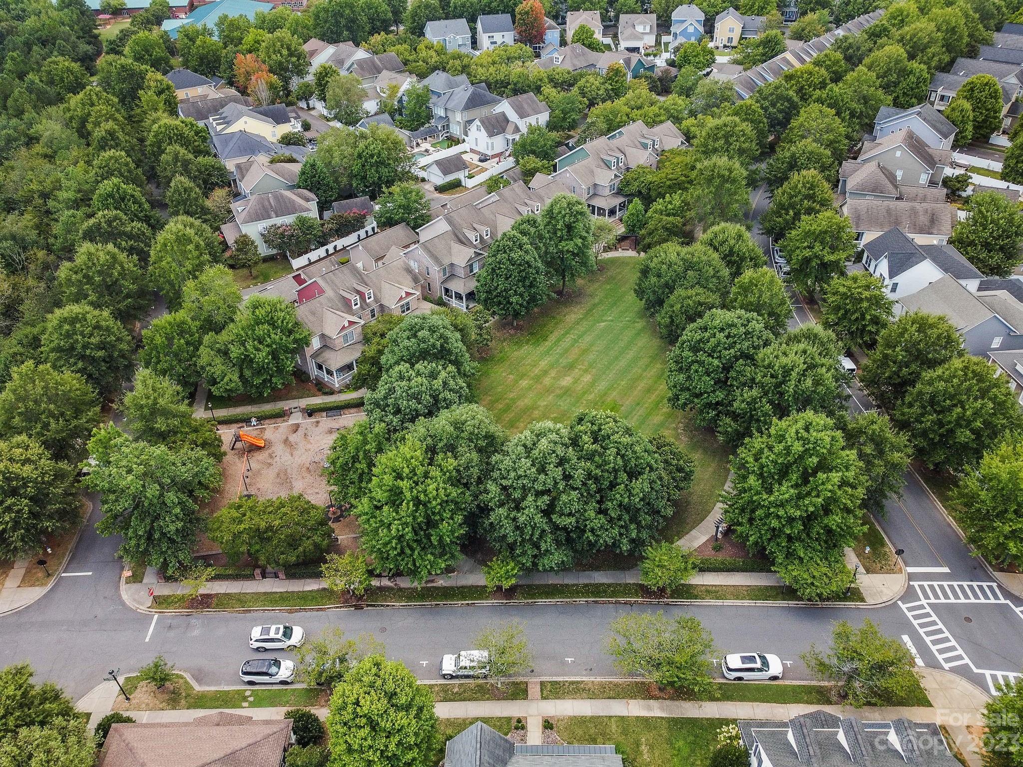 1042 Market Street Fort Mill, SC 29708 - Photo 32 of 34 an aerial view of a house with a yard and lake view