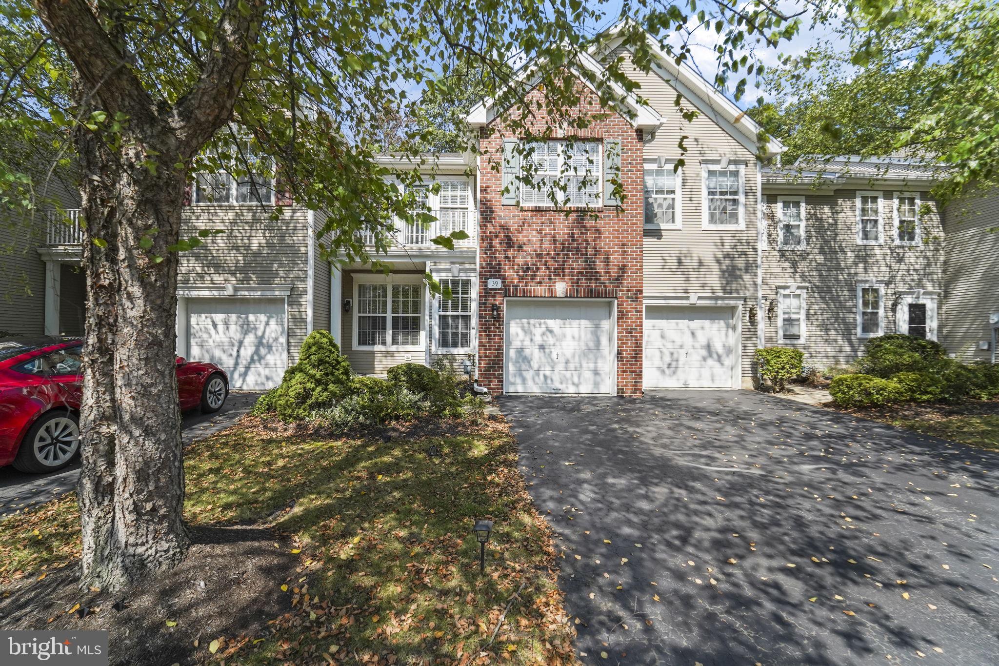 39 Normandy Drive Princeton Junction, NJ 08550 - Photo 1 of 2 a front view of a house with garden