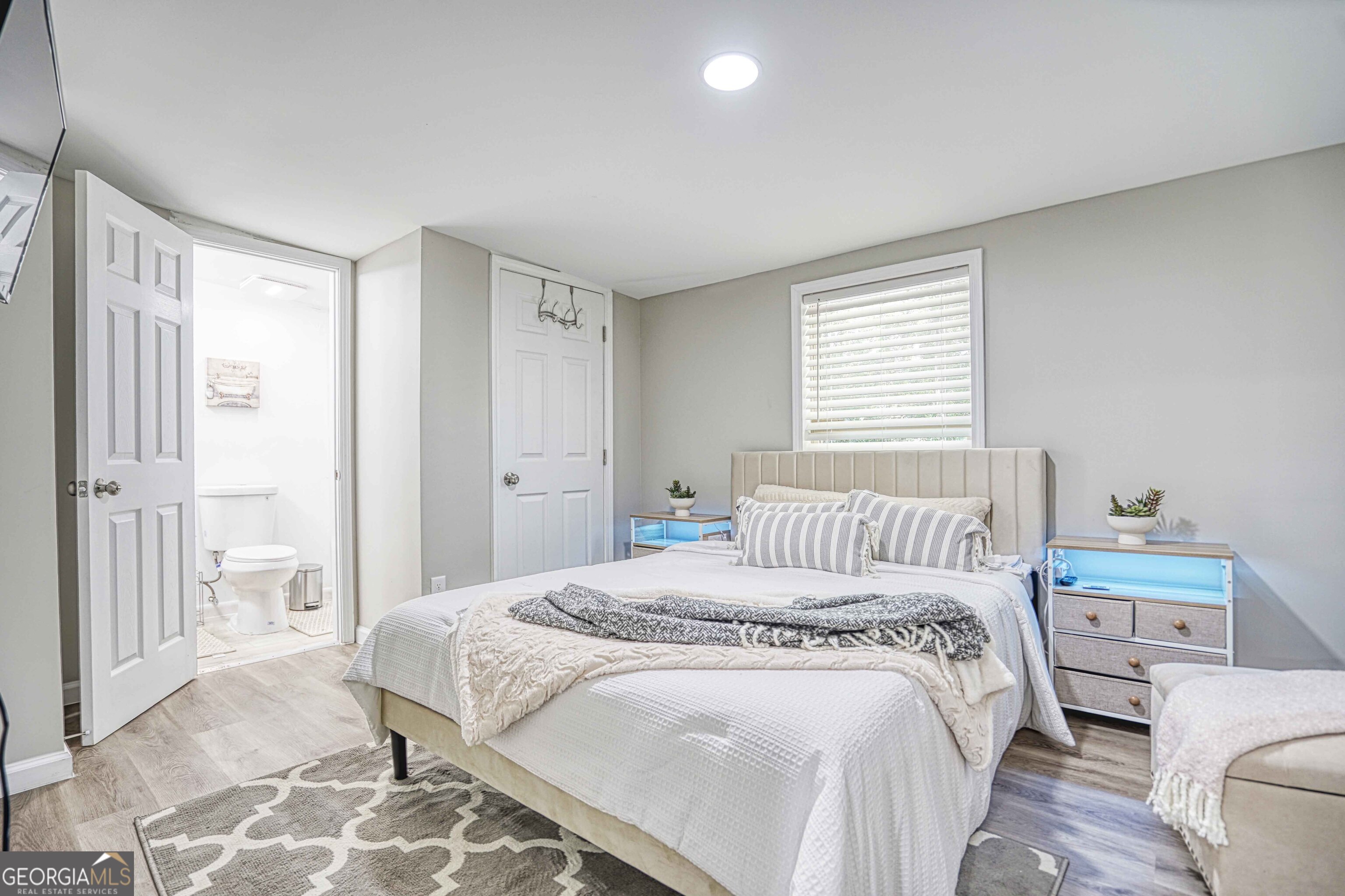 1827 Dunlap Avenue East Point, GA 30344 - Photo 12 of 32 a bedroom with a bed and a couch