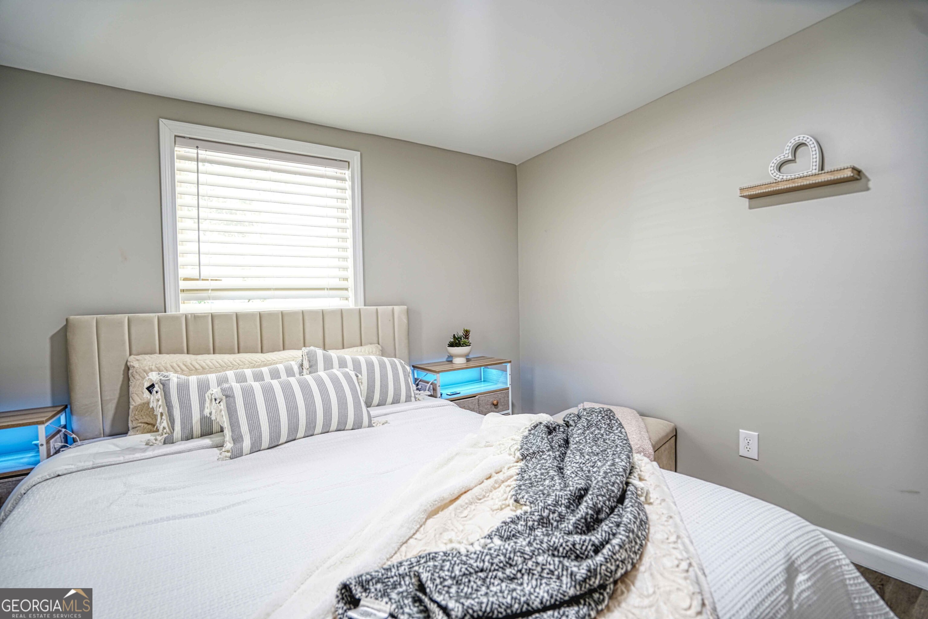 1827 Dunlap Avenue East Point, GA 30344 - Photo 13 of 32 a bedroom with a bed and a couch