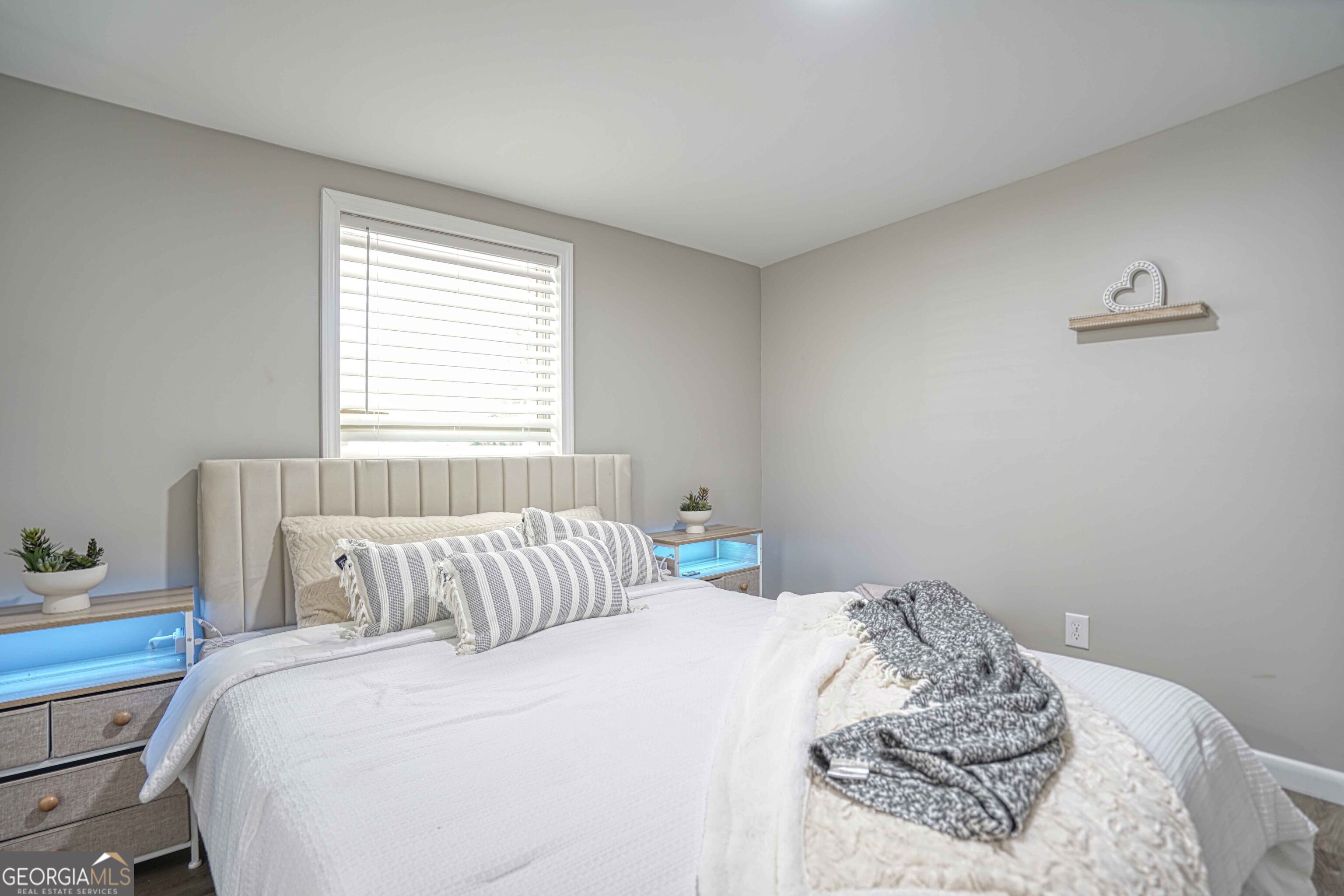 1827 Dunlap Avenue East Point, GA 30344 - Photo 14 of 32 a bedroom with a bed and a window