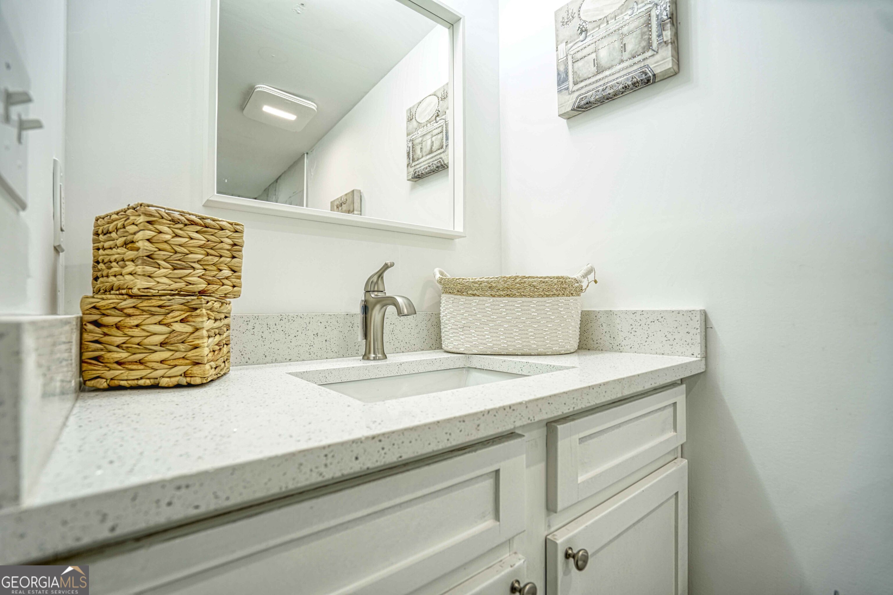 1827 Dunlap Avenue East Point, GA 30344 - Photo 16 of 32 a bathroom with a sink and a mirror