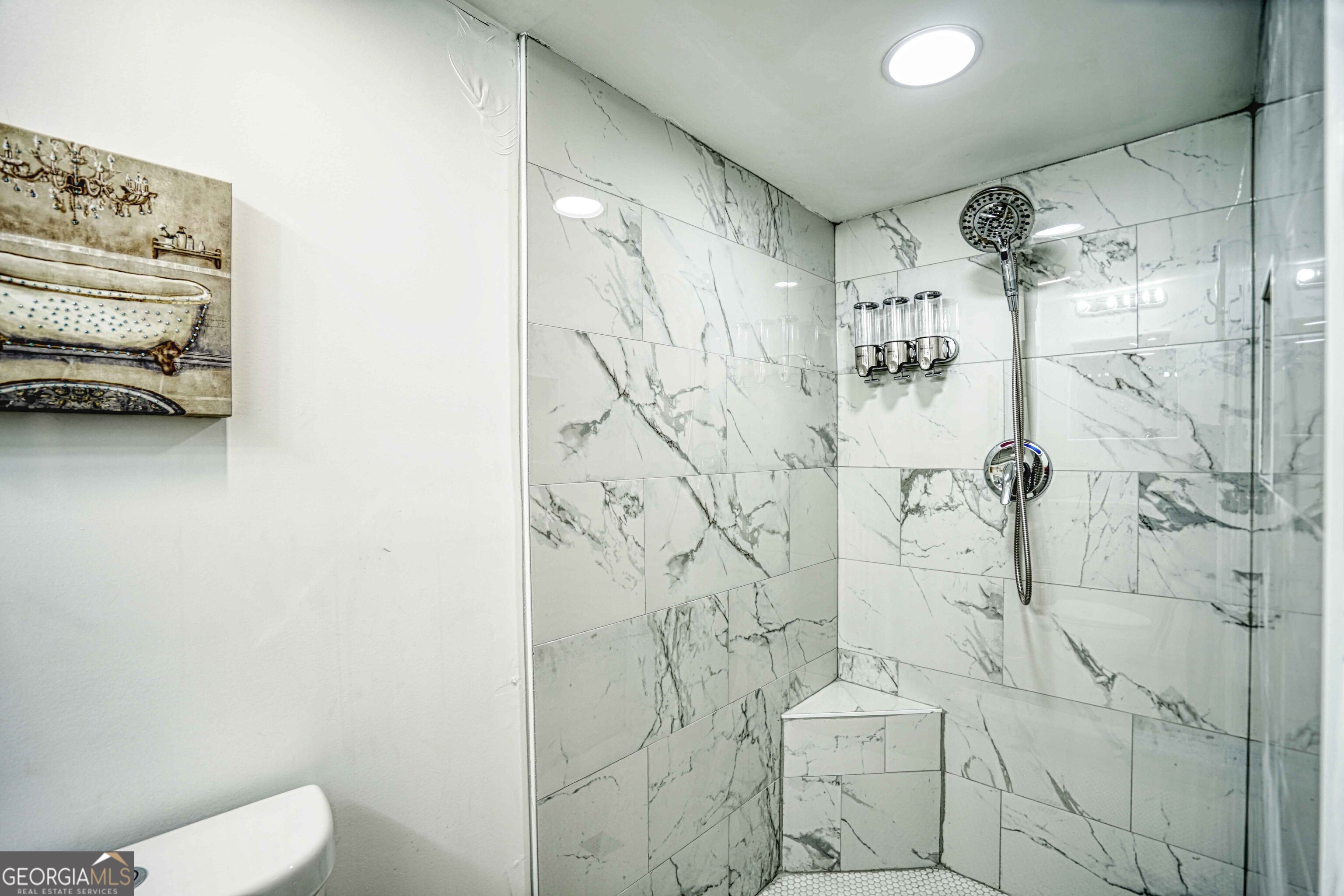 1827 Dunlap Avenue East Point, GA 30344 - Photo 17 of 32 a bathroom with a shower and a toilet