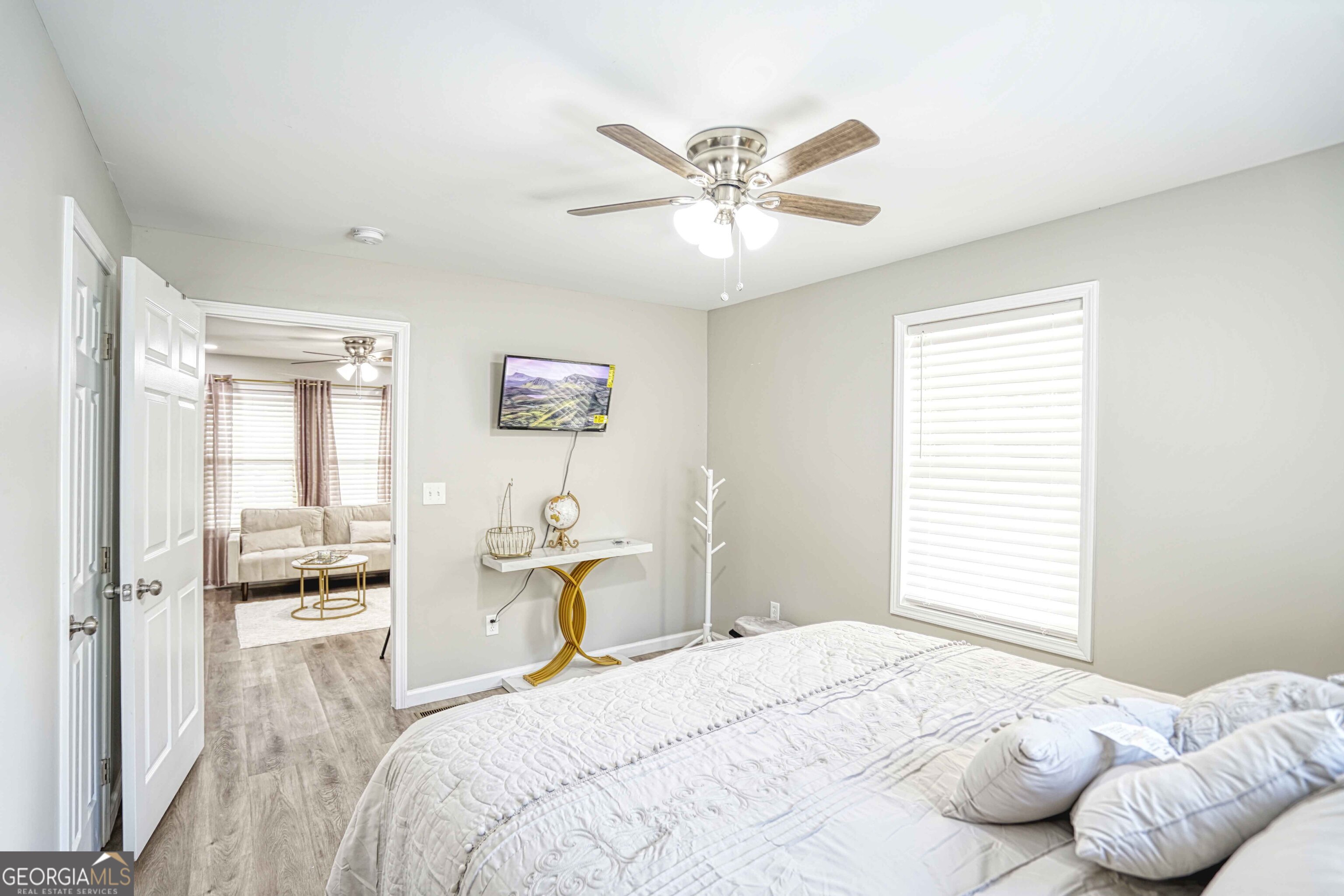 1827 Dunlap Avenue East Point, GA 30344 - Photo 20 of 32 a bedroom with a bed and wooden floor
