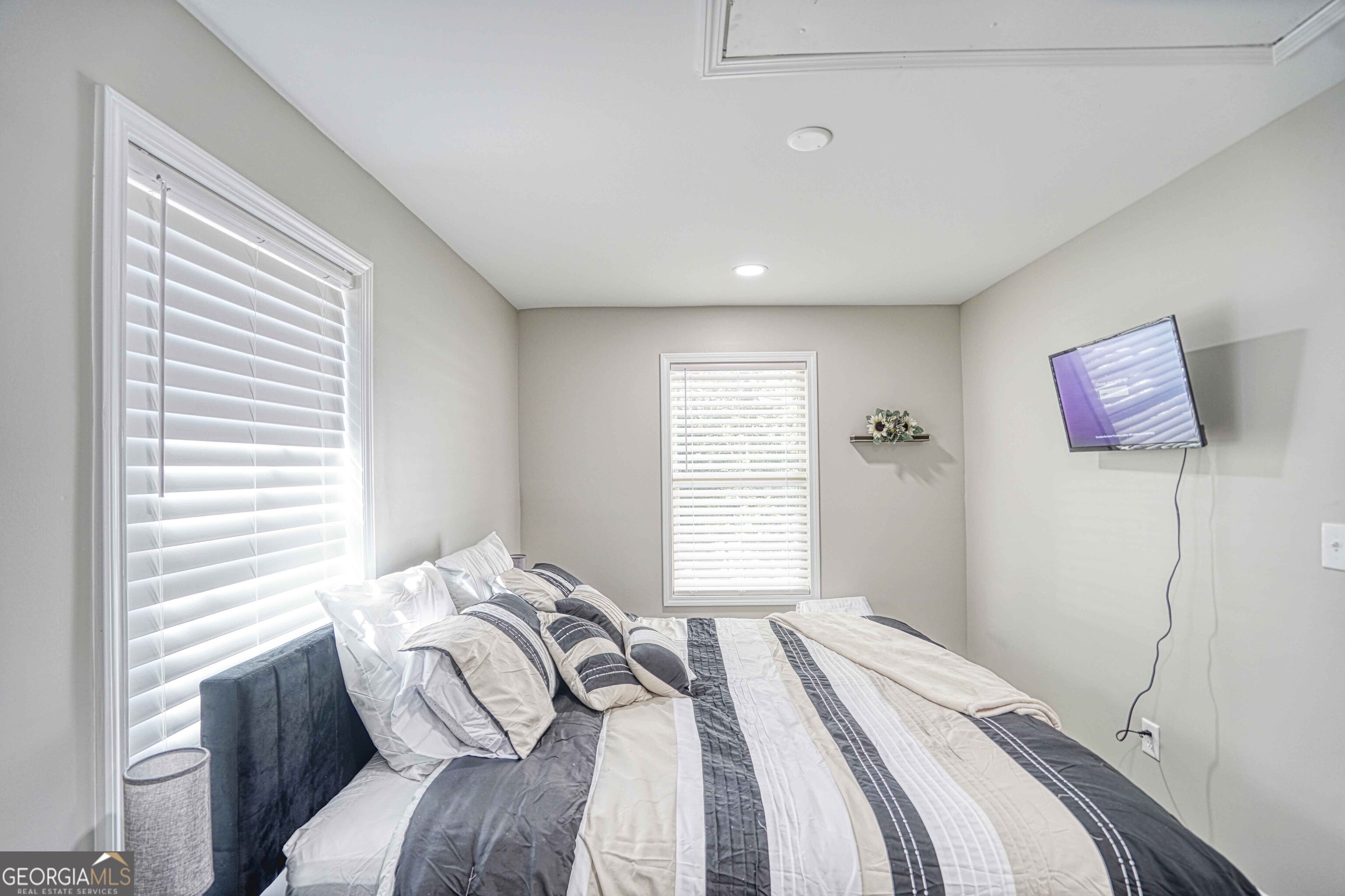 1827 Dunlap Avenue East Point, GA 30344 - Photo 22 of 32 a bedroom with a bed and a window