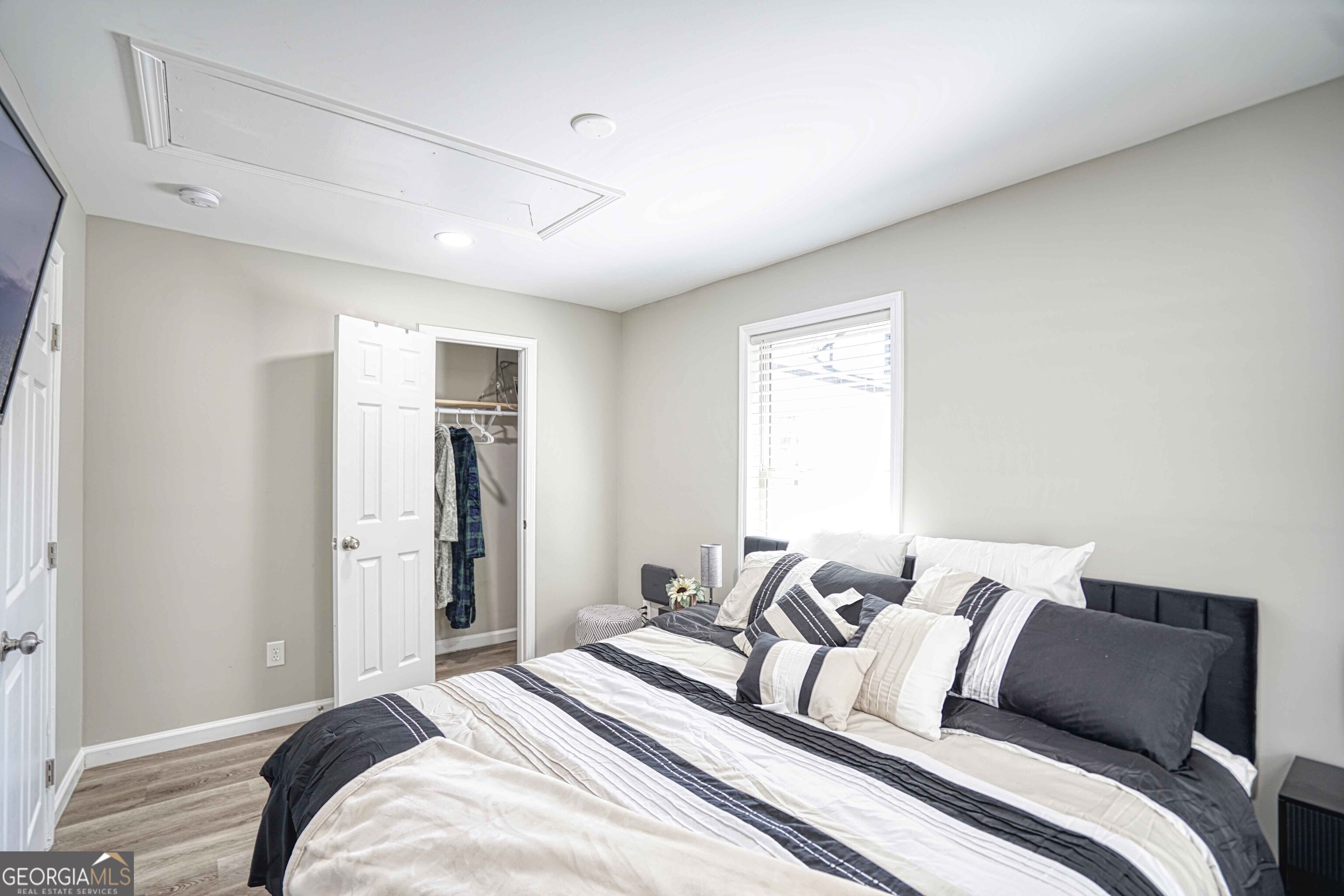 1827 Dunlap Avenue East Point, GA 30344 - Photo 23 of 32 a bedroom with a bed and a window