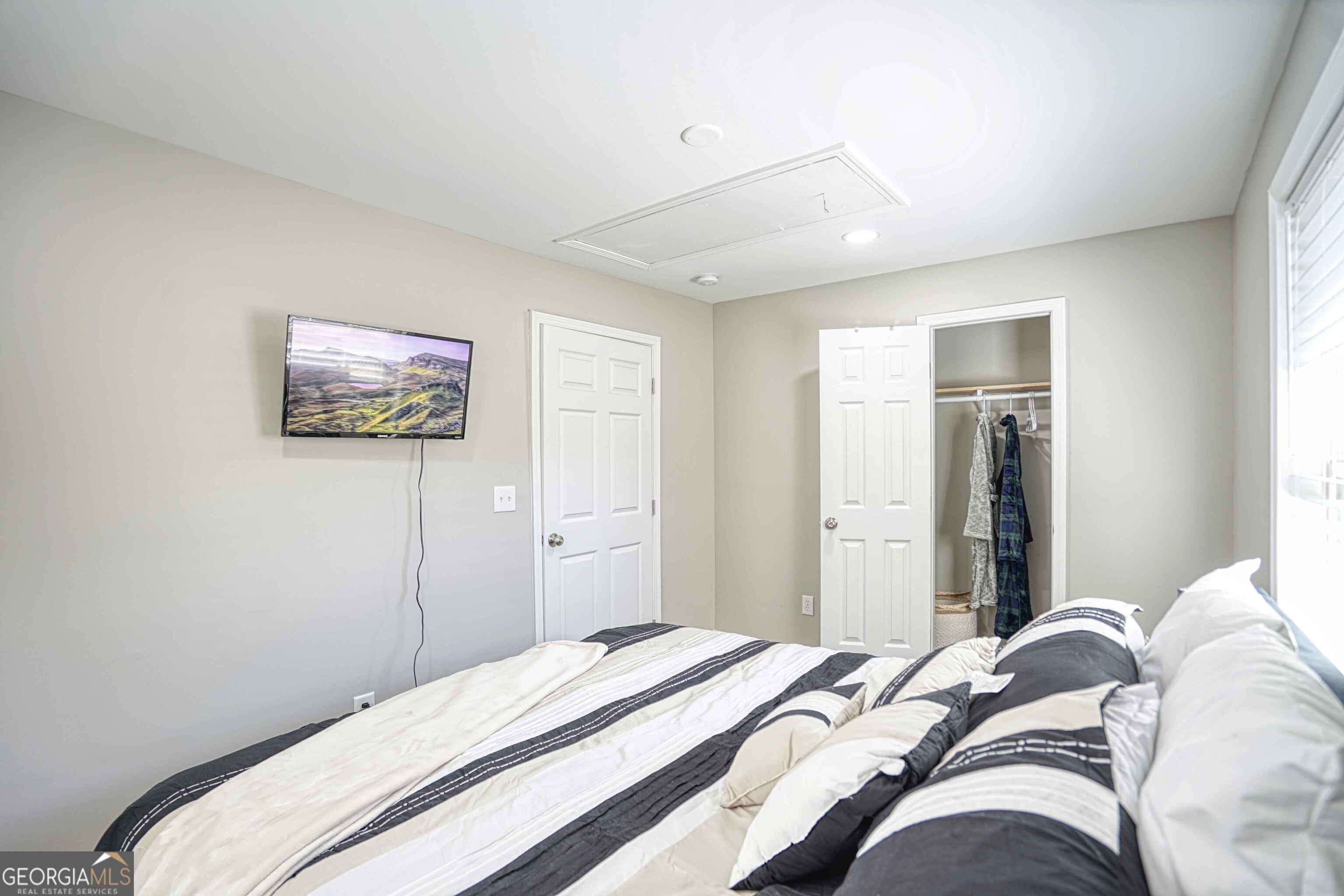 1827 Dunlap Avenue East Point, GA 30344 - Photo 24 of 32 a bedroom with a bed and a painting