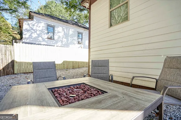 a view of a house with a bench