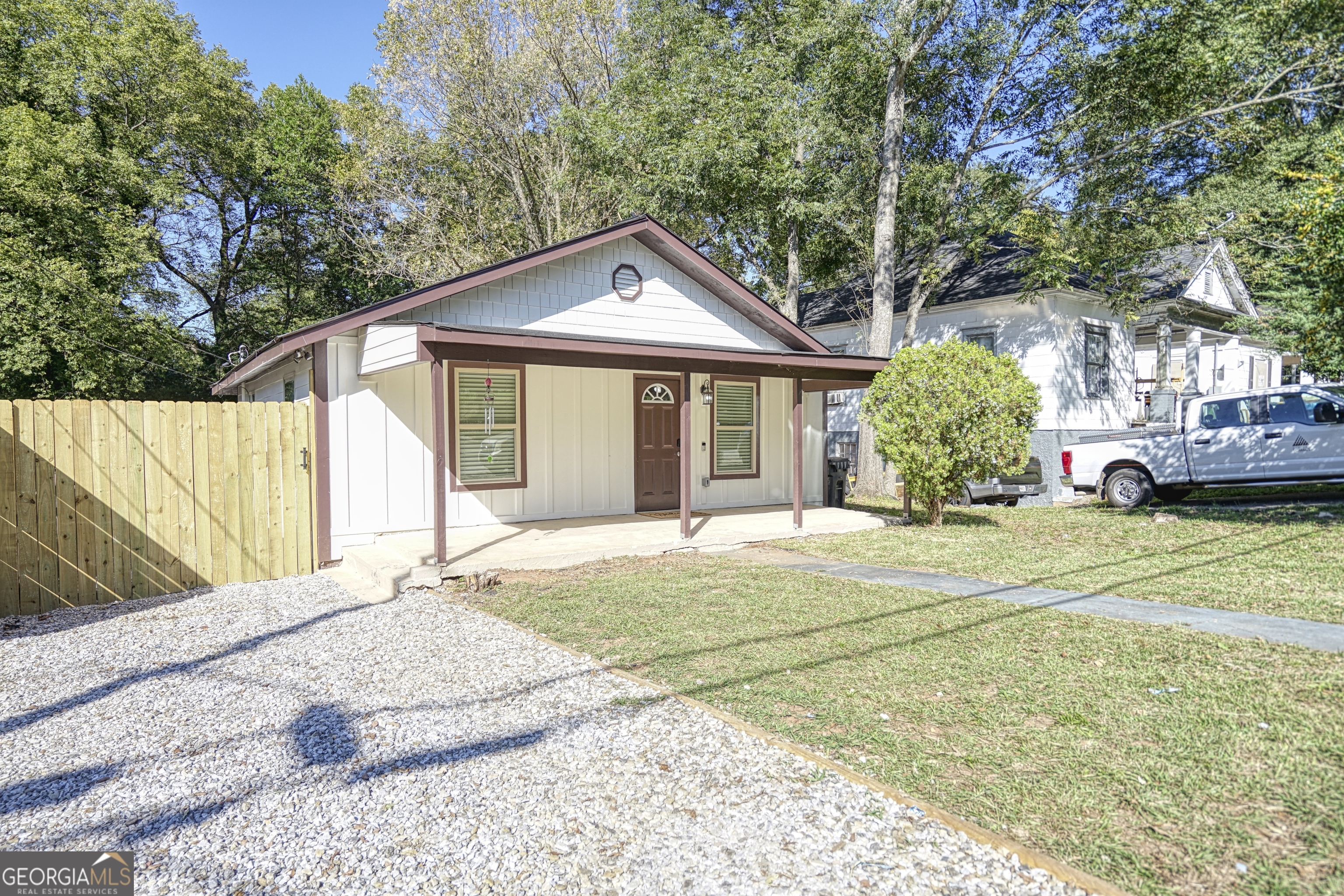 1827 Dunlap Avenue East Point, GA 30344 - Photo 31 of 32 a front view of a house with a garden and trees