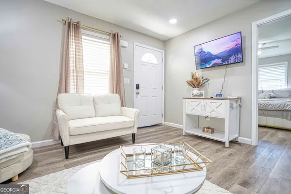 a living room with furniture and a fireplace