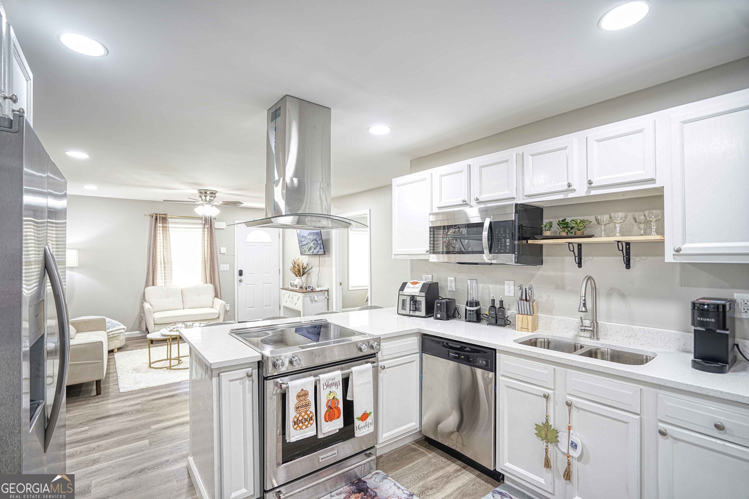1827 Dunlap Avenue East Point, GA 30344 - Photo 6 of 32 a kitchen with a stove a sink and a refrigerator