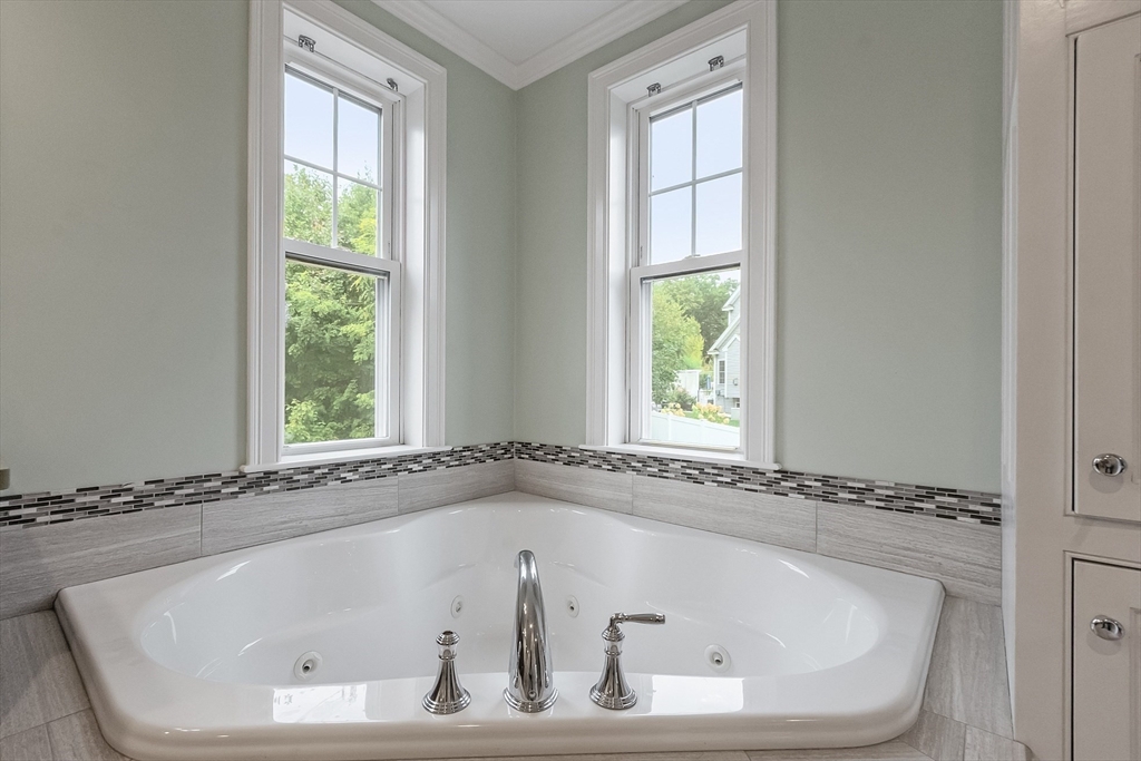 42 Fox Run Road Bolton, MA 01740 - Photo 18 of 42 a white bath tub sitting in a bathroom next to a window