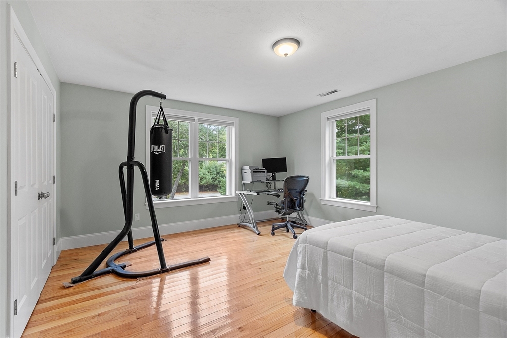 42 Fox Run Road Bolton, MA 01740 - Photo 19 of 42 a view of a room with gym equipment and a large window