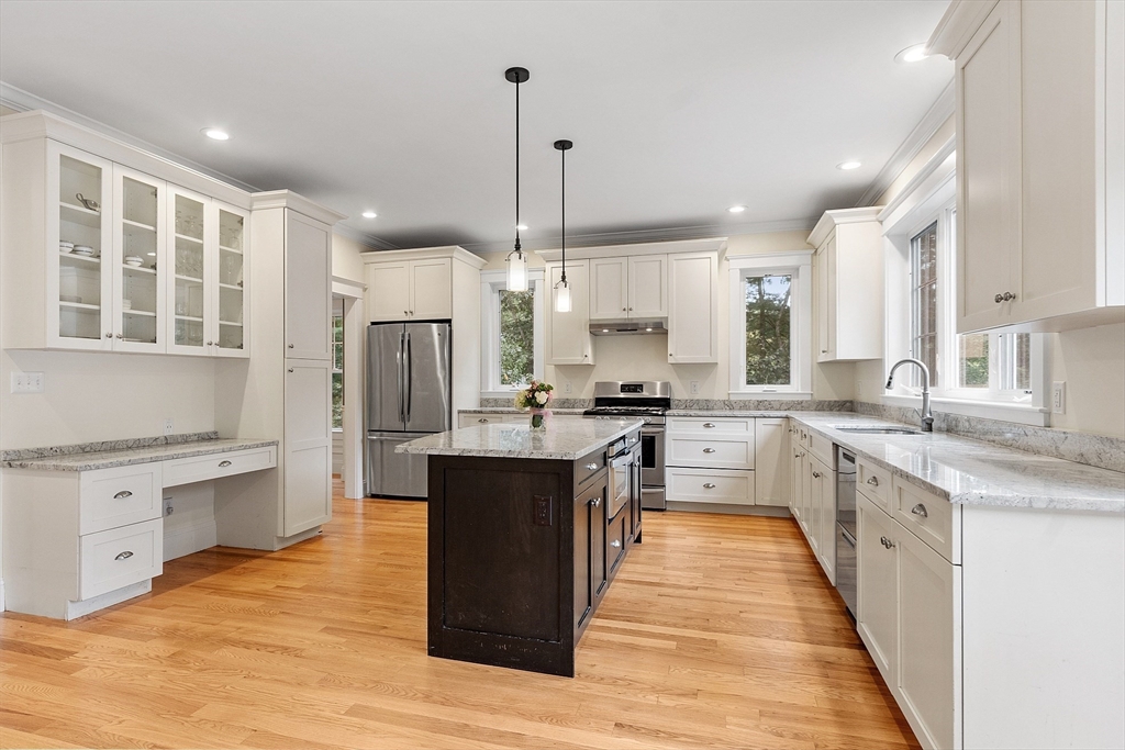 42 Fox Run Road Bolton, MA 01740 - Photo 2 of 42 a kitchen with stainless steel appliances granite countertop a stove top oven a sink dishwasher a refrigerator and white cabinets with wooden floor