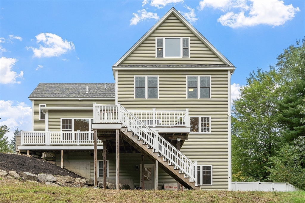 42 Fox Run Road Bolton, MA 01740 - Photo 39 of 42 a front view of a house with a yard