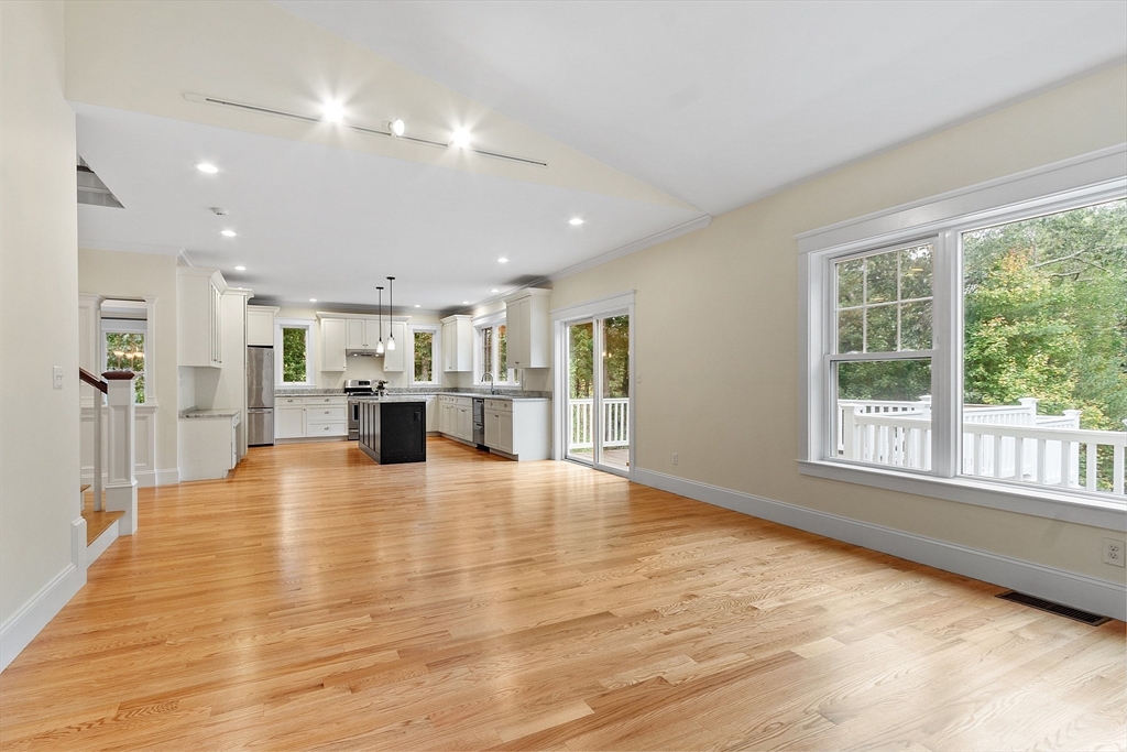 42 Fox Run Road Bolton, MA 01740 - Photo 5 of 42 a view of an empty room with kitchen view and a window