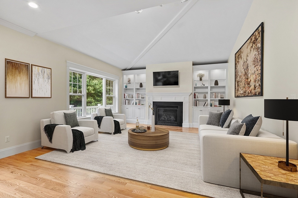 42 Fox Run Road Bolton, MA 01740 - Photo 6 of 42 a living room with furniture a large window and a fireplace