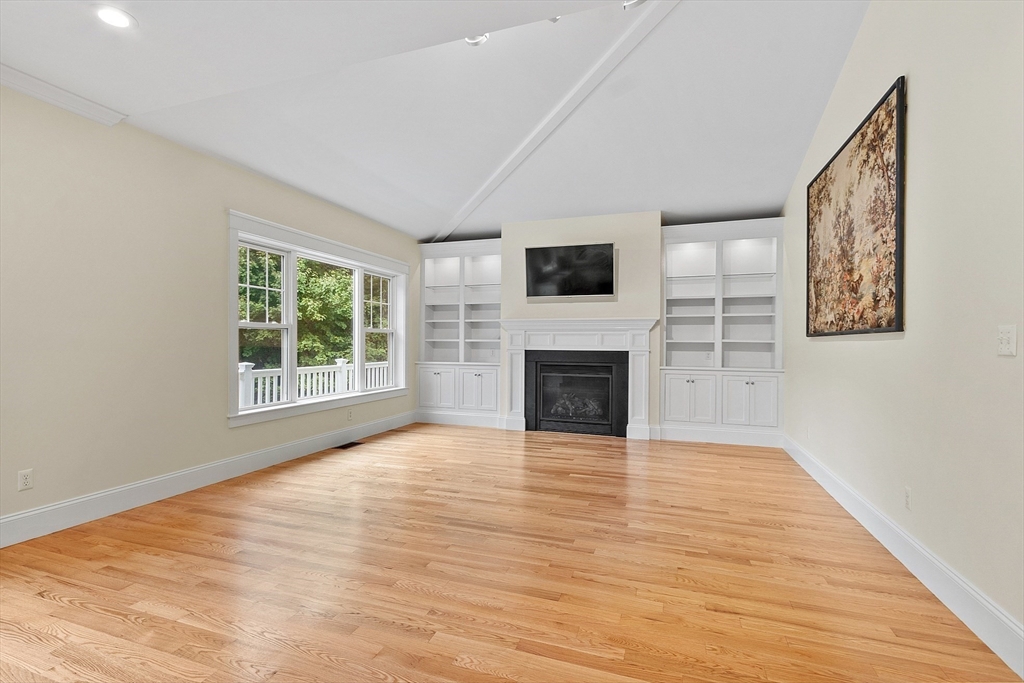 42 Fox Run Road Bolton, MA 01740 - Photo 7 of 42 a view of empty room with wooden floor and fireplace
