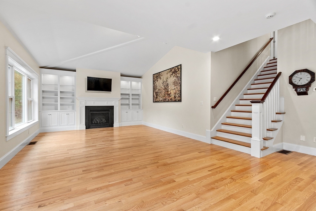 42 Fox Run Road Bolton, MA 01740 - Photo 8 of 42 a view of a livingroom with wooden floor and fireplace
