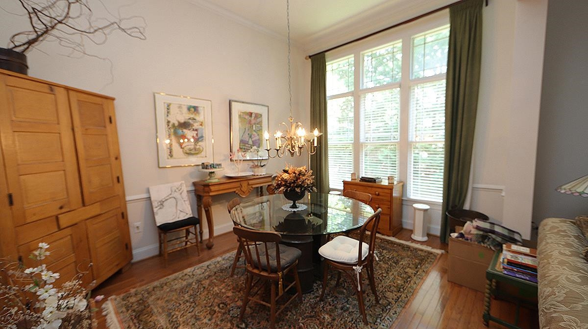 4802 Crestmore Road Raleigh, NC 27612 - Photo 8 of 25 with 11.5 ft ceilings and wall of windows Dining room