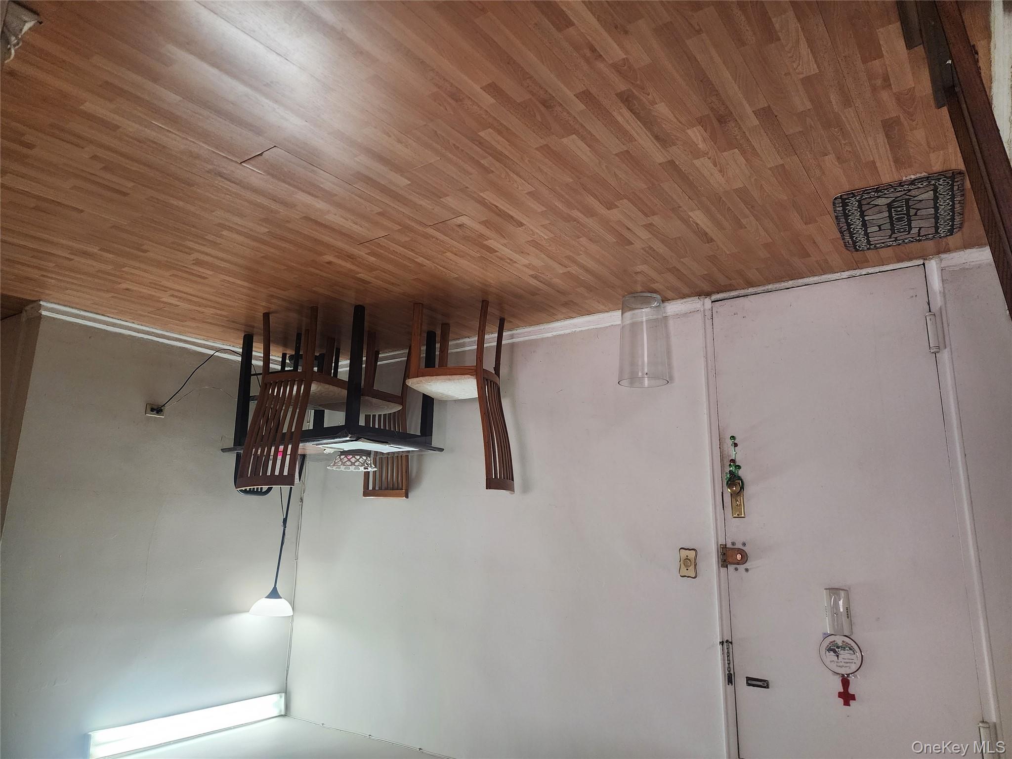 99-11 60th Avenue, Unit 3E Queens, NY 11368 - Photo 11 of 12 a view of a dining room with furniture and wooden floor