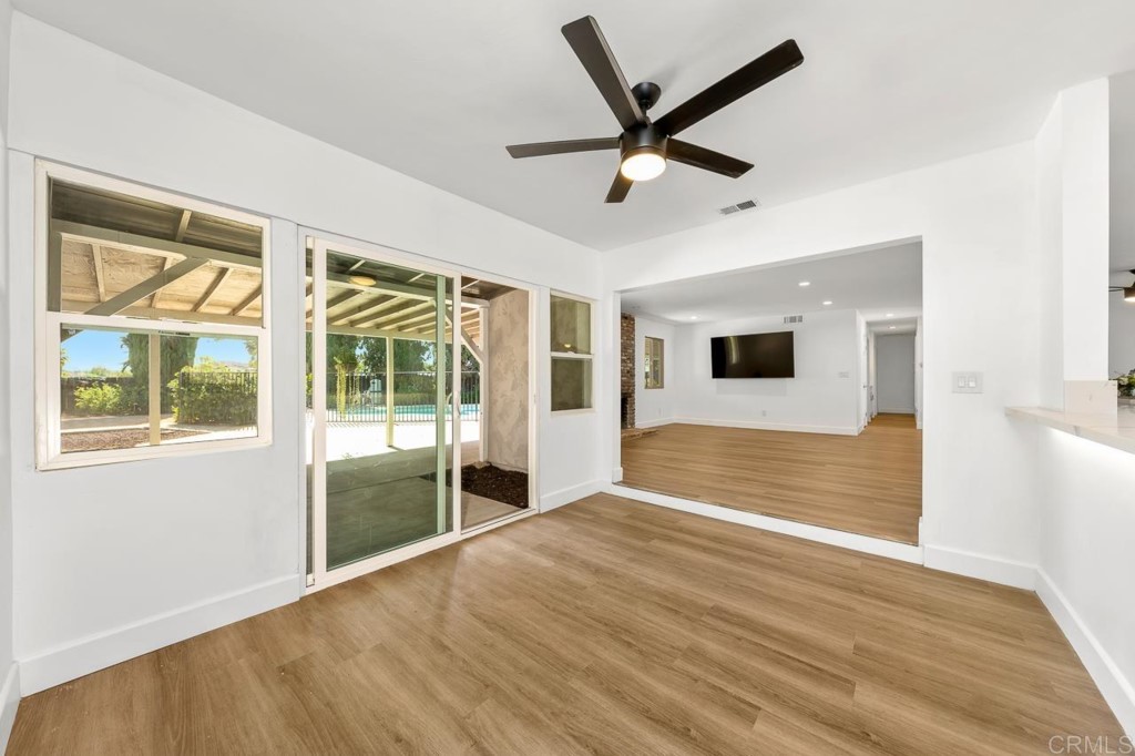 1740 Wind River Road El Cajon, CA 92019 - Photo 11 of 35 a view of empty room with wooden floor and fan