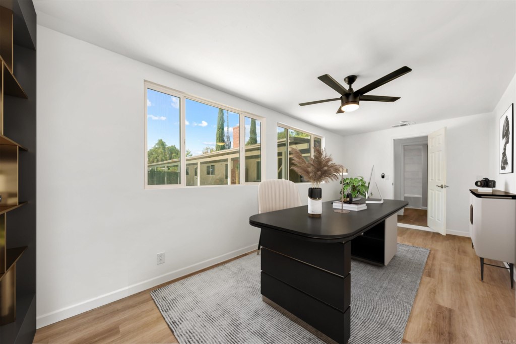 1740 Wind River Road El Cajon, CA 92019 - Photo 19 of 35 a living room with furniture a window and a potted plant