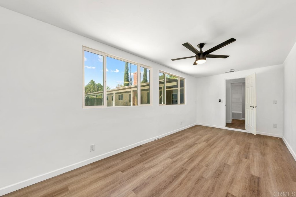1740 Wind River Road El Cajon, CA 92019 - Photo 20 of 35 a view of a big room with wooden floor and windows