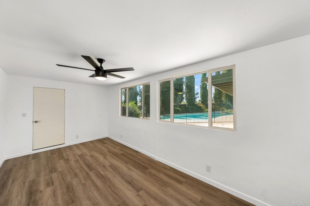 1740 Wind River Road El Cajon, CA 92019 - Photo 22 of 35 a view of empty room with wooden floor and fan