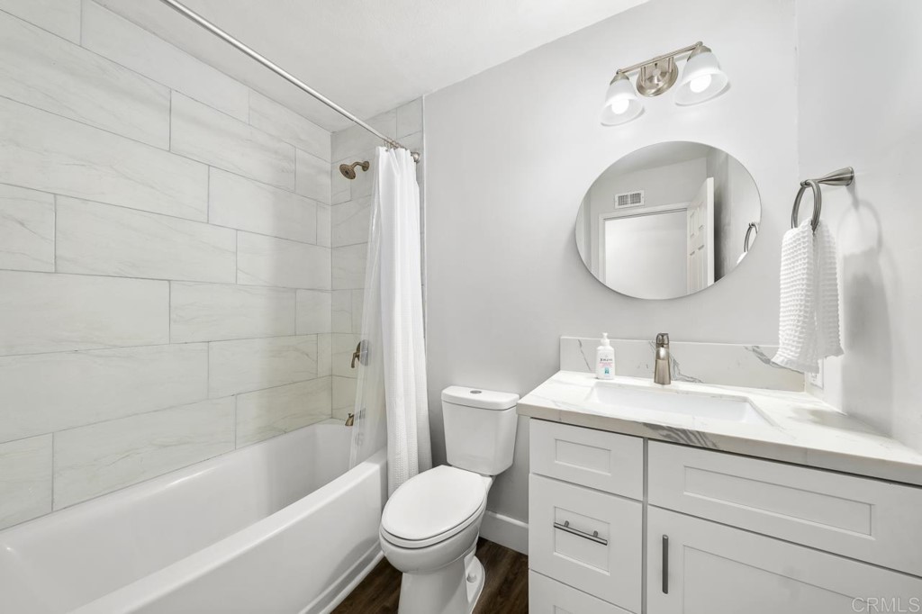 1740 Wind River Road El Cajon, CA 92019 - Photo 23 of 35 a bathroom with a sink toilet and shower