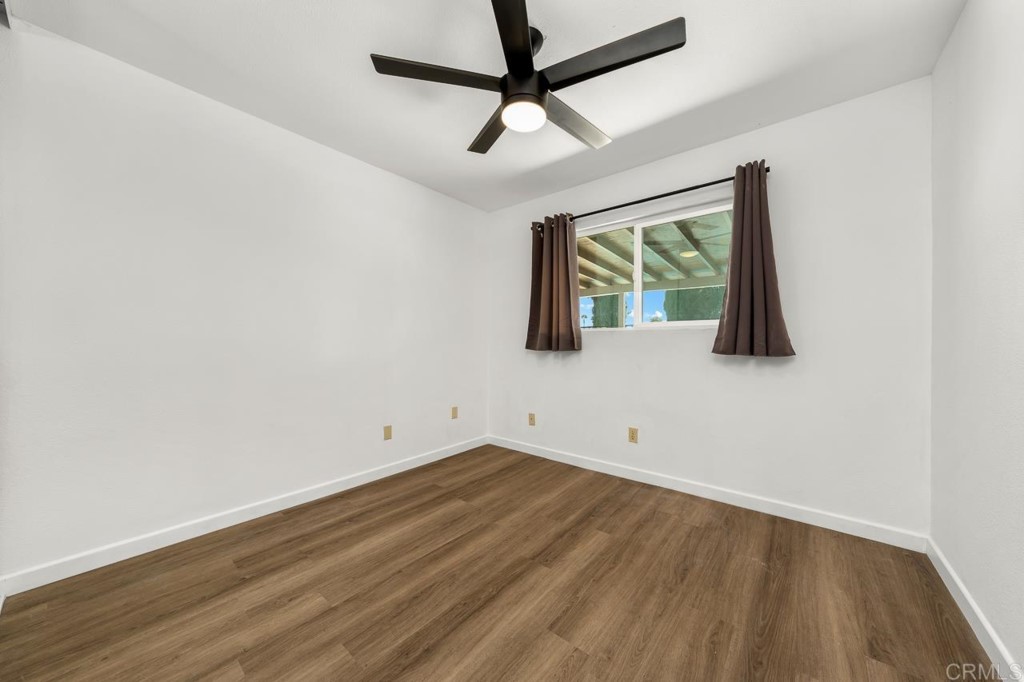 1740 Wind River Road El Cajon, CA 92019 - Photo 25 of 35 a view of room with window and wooden floor