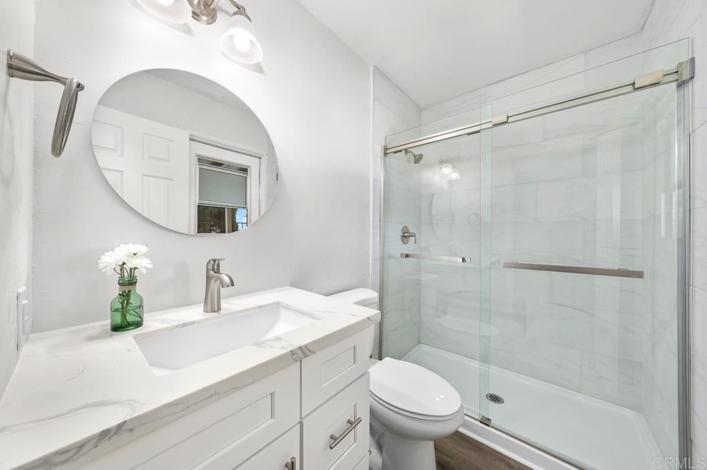 1740 Wind River Road El Cajon, CA 92019 - Photo 29 of 35 a bathroom with a sink toilet and shower