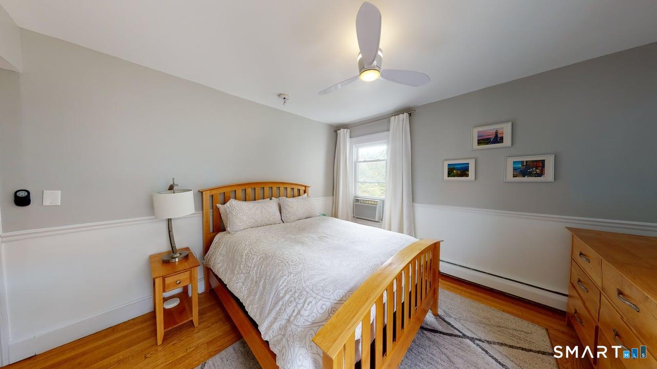 6 Eld Street New Haven, CT 06511 - Photo 11 of 43 a bedroom with a bed and a chandelier