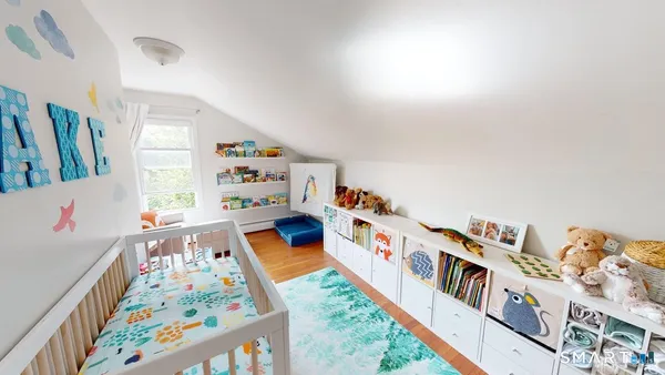 a children room with toys and a book shelf