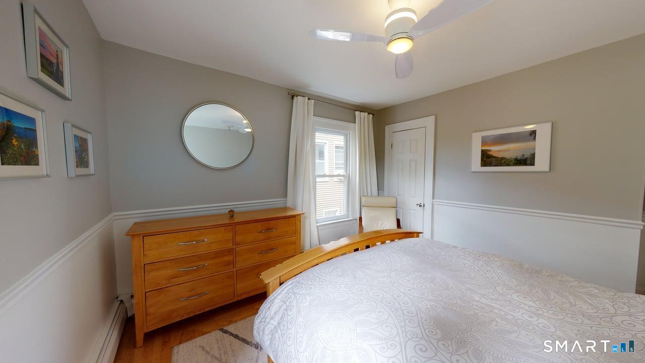 6 Eld Street New Haven, CT 06511 - Photo 25 of 43 a bedroom with a bed and a chandelier