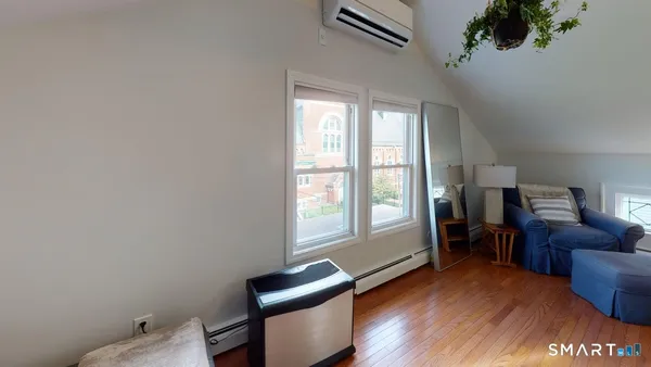 a living room with furniture and a window