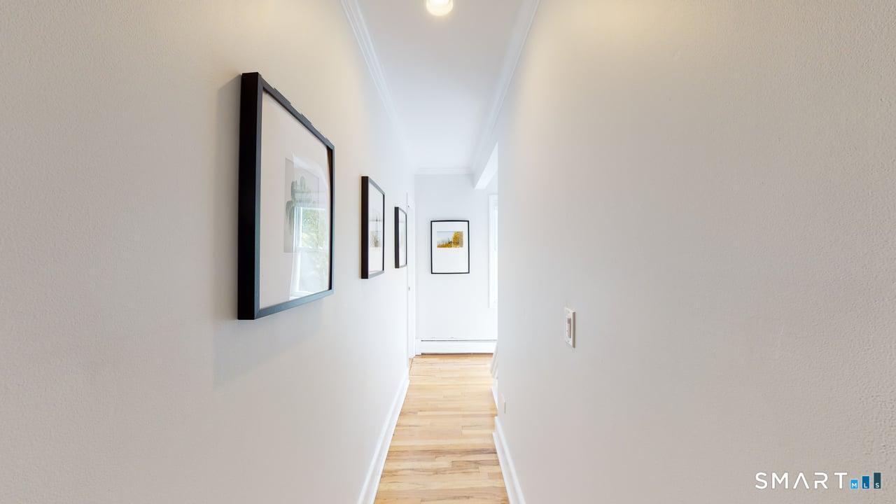 6 Eld Street New Haven, CT 06511 - Photo 30 of 43 a hallway with wooden floor windows and stairs