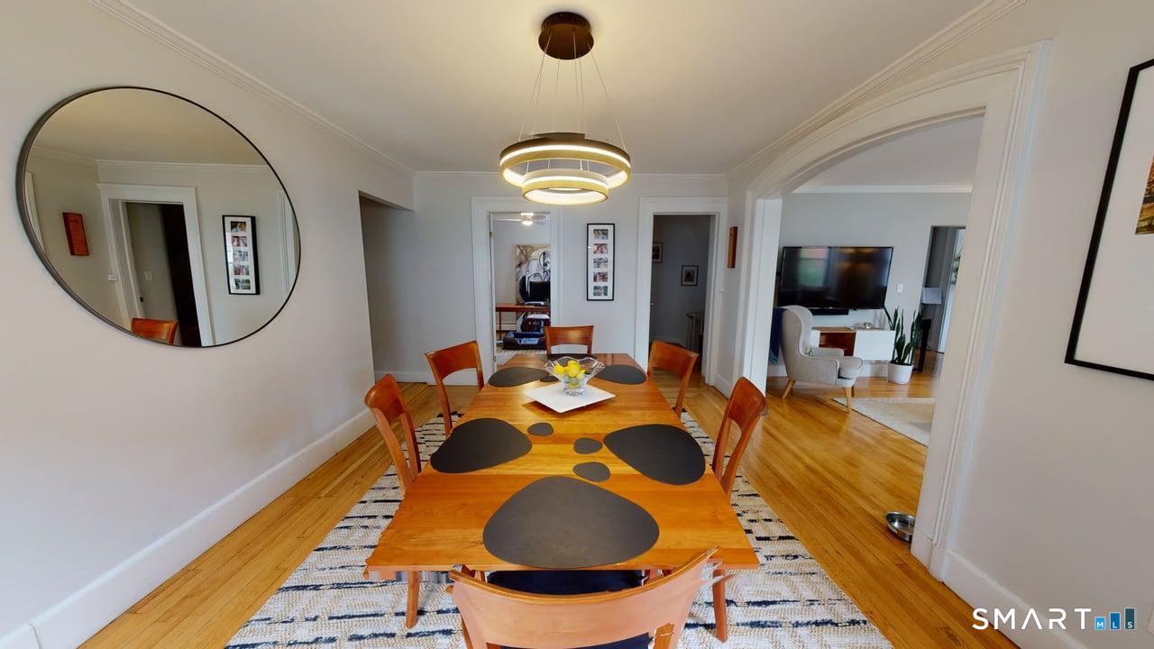 6 Eld Street New Haven, CT 06511 - Photo 35 of 43 a dining room with furniture and a mirror