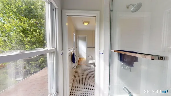a view of a bathroom from a hallway