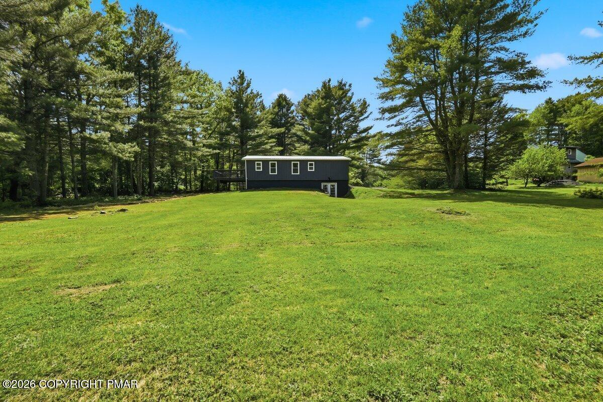 155 Blooming Grove Road Hawley, PA 18428 - Photo 9 of 41 a front view of a house with a yard