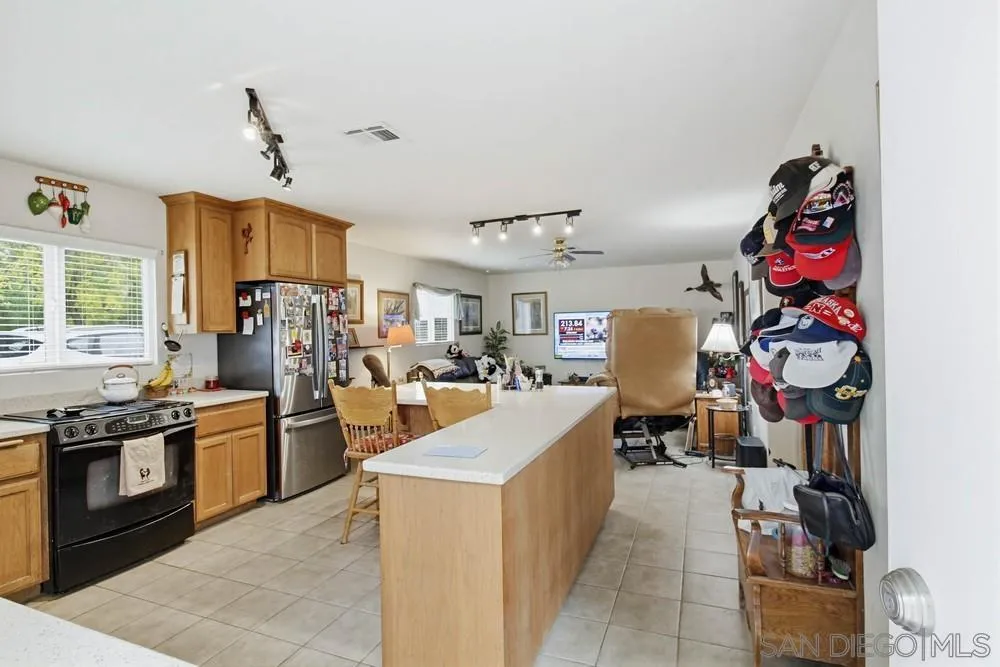 1478 Peutz Valley Road Alpine, CA 91901 - Photo 11 of 63 a kitchen filled with stainless steel appliances granite countertop a stove and a refrigerator