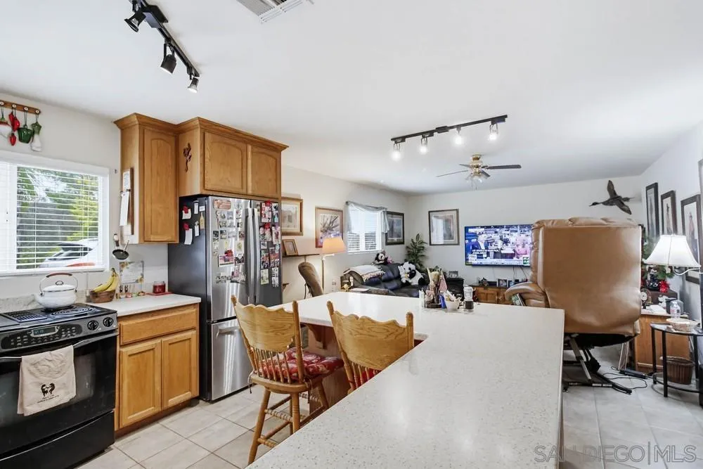 1478 Peutz Valley Road Alpine, CA 91901 - Photo 13 of 63 a living room with lots of furniture and appliances
