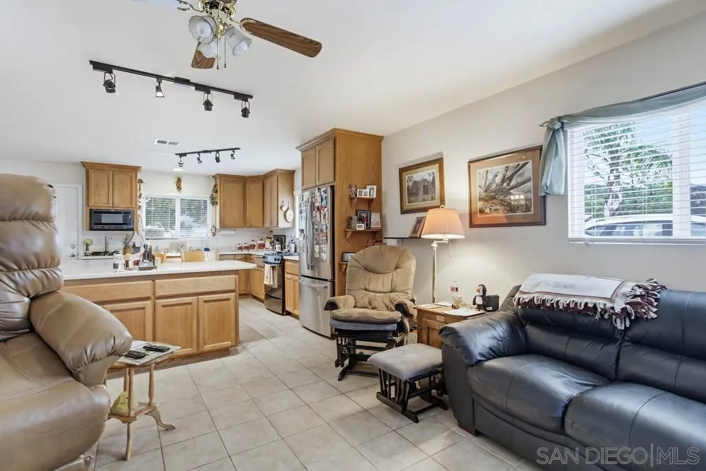 1478 Peutz Valley Road Alpine, CA 91901 - Photo 16 of 63 a living room with furniture and kitchen view